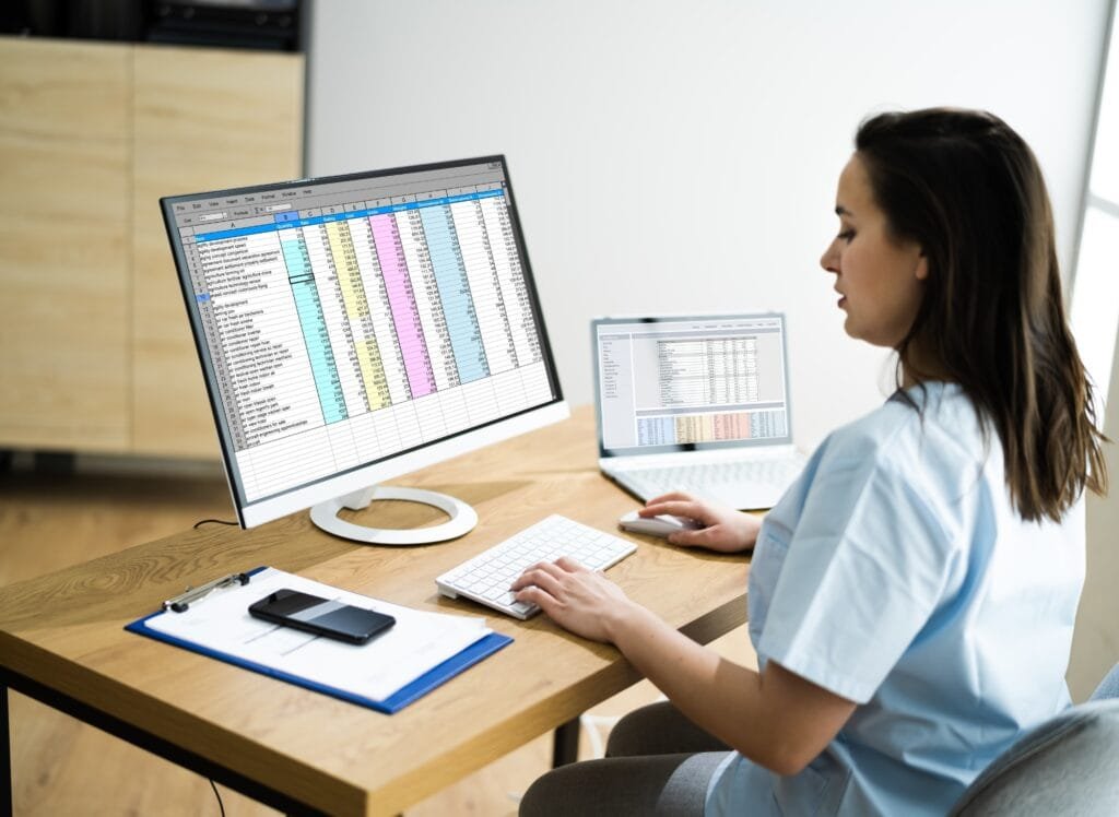 Medical Billing_Career Medical billing professional working on billing spreadsheets